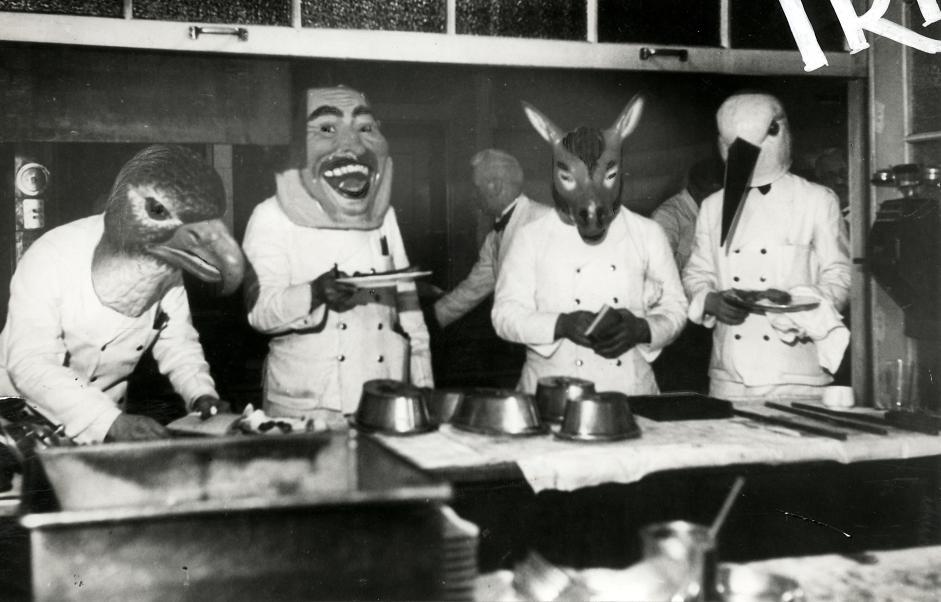 Nationaal Archief / Spaarnestad Photo / Het Leven, SFA022817069. Mardi Gras in a restaurant in Bayern, the waiters are wearing masks. München, Germany, 1933.