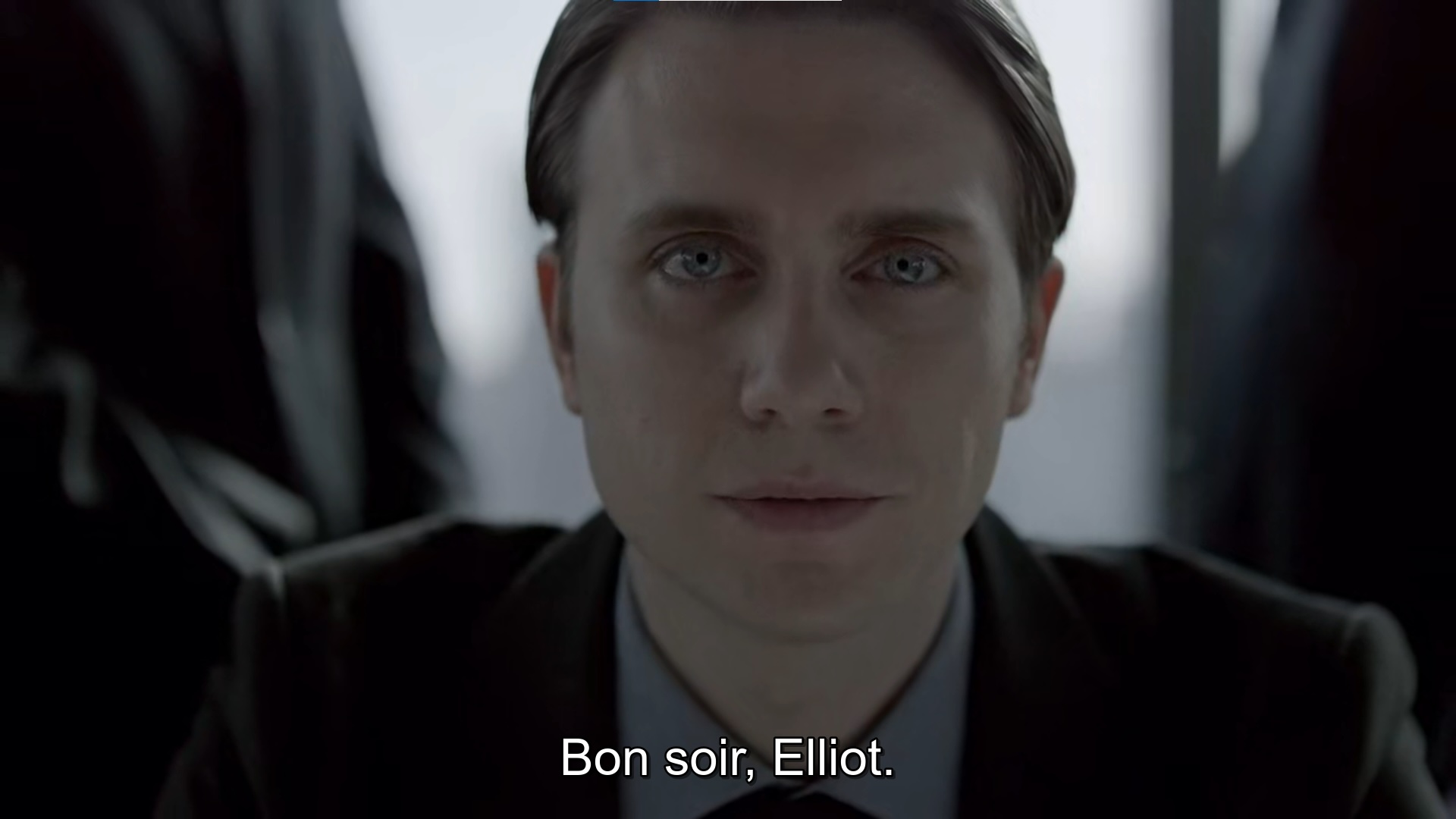 Close up frame of the character Tyrell Wellick from the TV series, "Mr. Robot." At bottom is the caption, "Bon soir, Elliot," a phrase frequently used by Wellick.